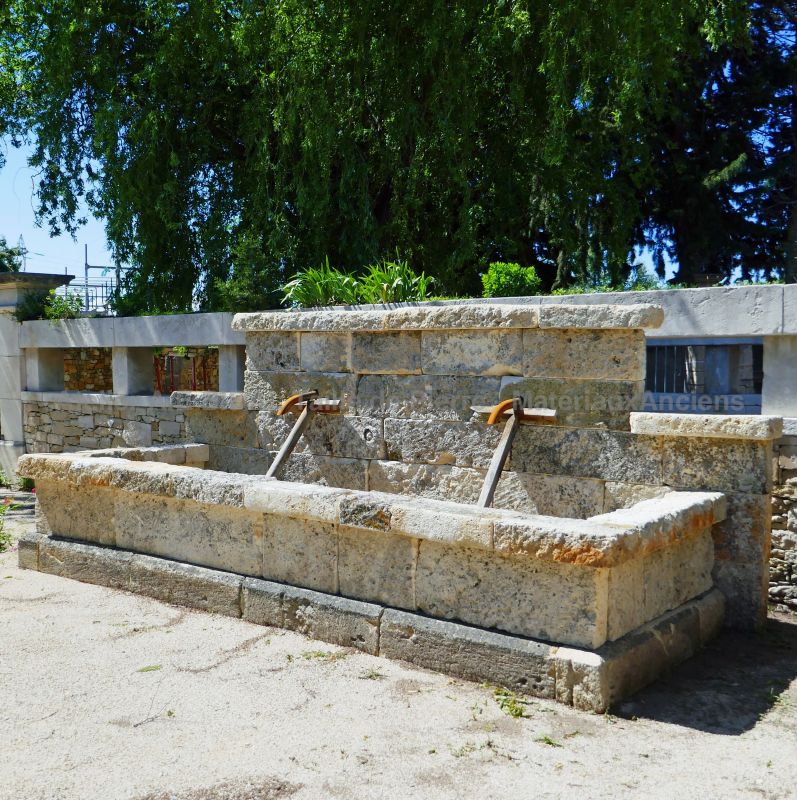 Large wall fountain in old stones : antique garden fountain in stone