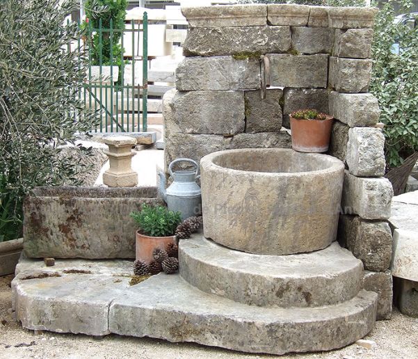 Stone corner fountain with steps