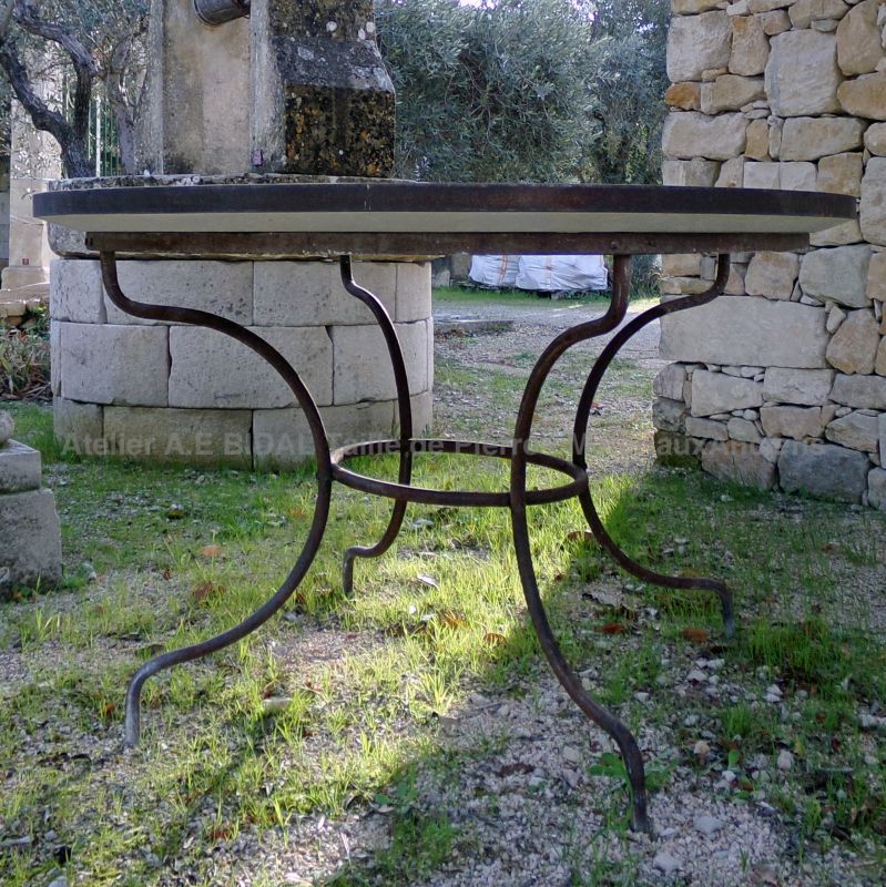 Garden furniture : outdoor table with stone tabletop and wrought iron base - Atelier Alain BIDAL (Provence)