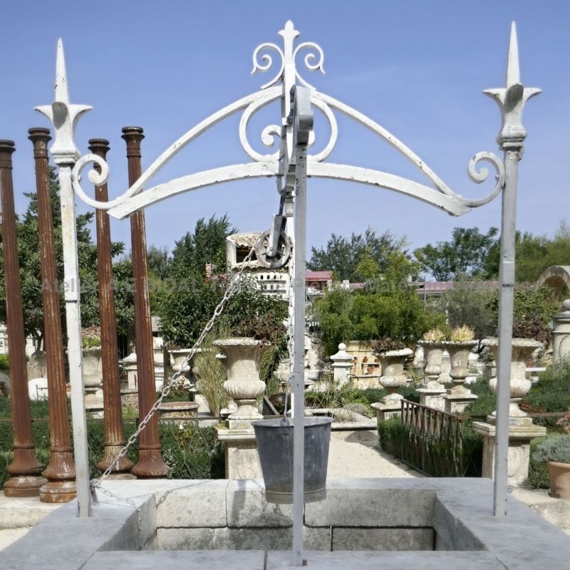 Detail of the ironwork on our well in old stones on sale at Alain BIDAL in Provence.