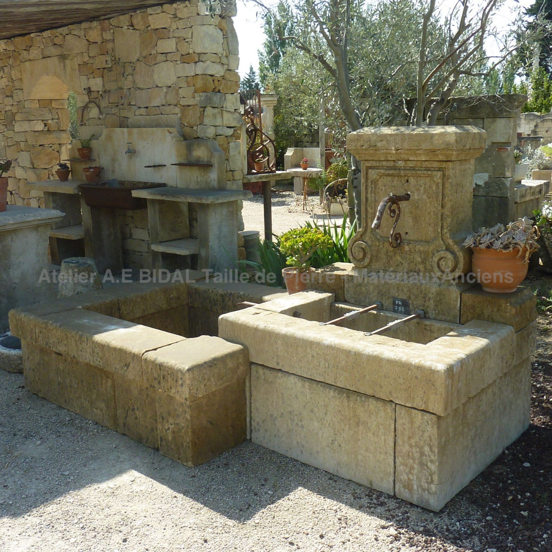 Garden fountain with double basin: a garden fountain, in a wall fountain style.