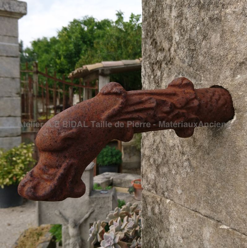 Large cast iron gargoyle : antique water outlet on our stone garden fountain.