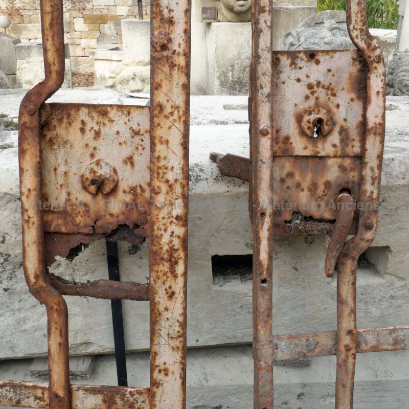Detail of the lock on our antique semi-openworked wrought iron double gate.