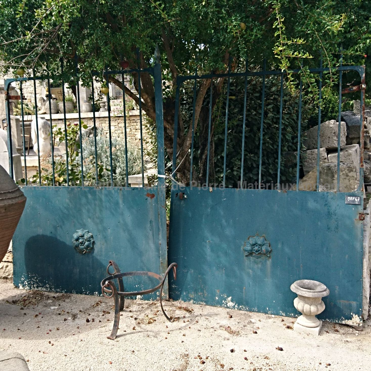 Antique gate made of riveted wrought iron - a beautiful ancient gate.