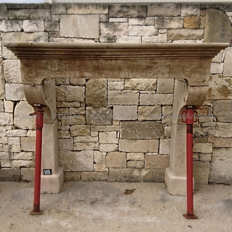 Large antique fireplace in stone - A Louis 14 mantle.