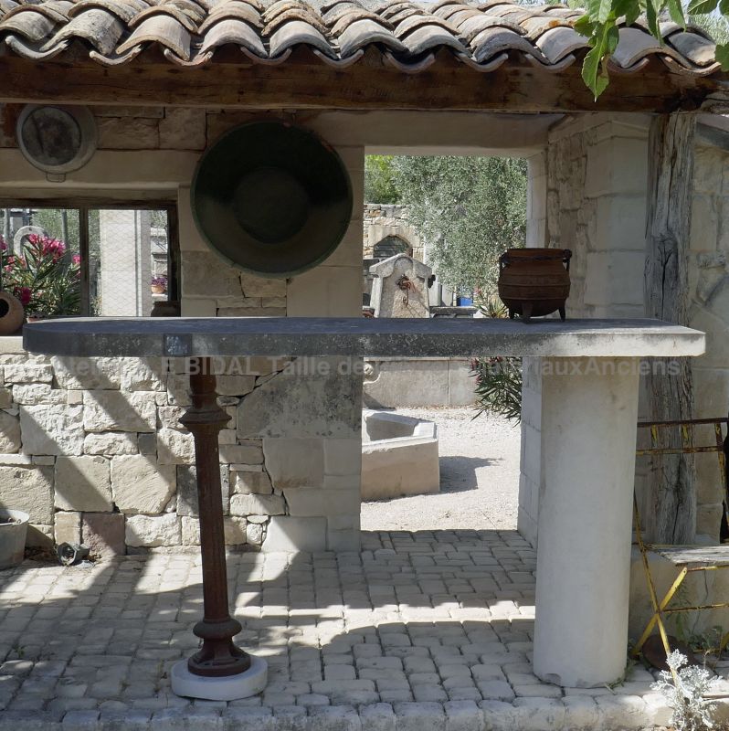 For a summer kitchen: bar table made of old cast iron.