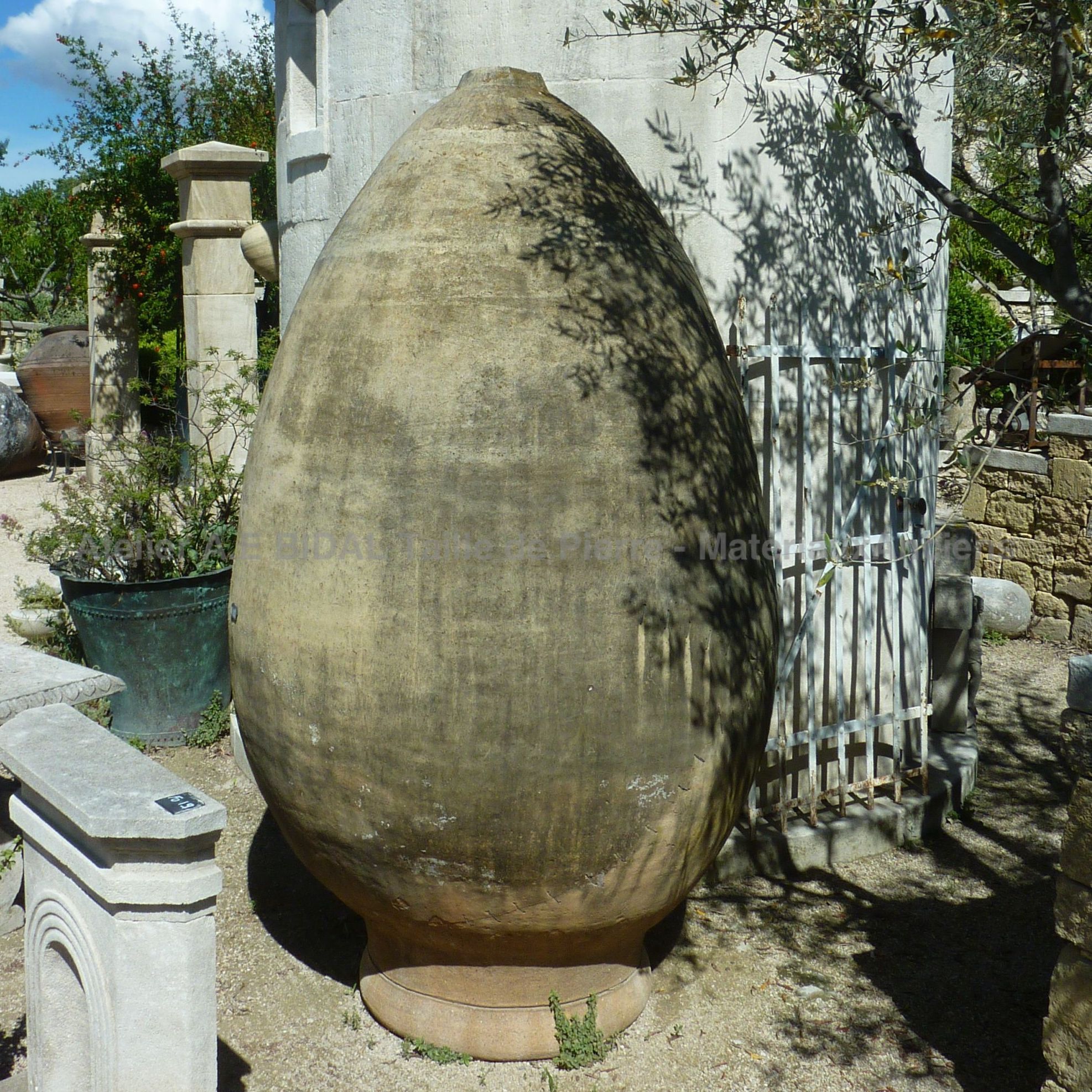 Old jar made of ight colored terracotta  - restored old jar.