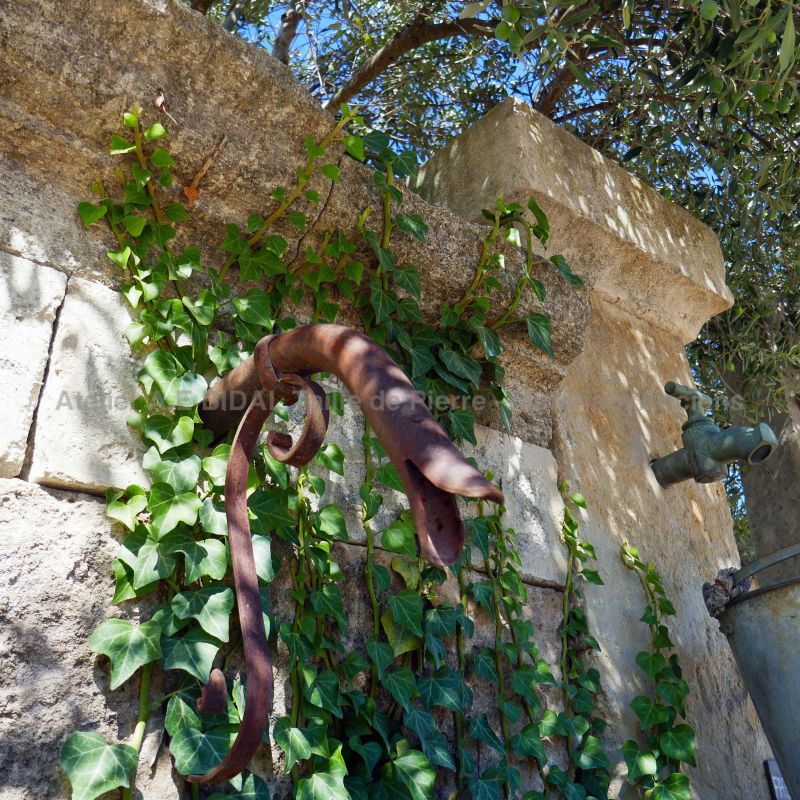 Detailed pictured of the pediment on our large garden fountain in stone and metal - Alain Bidal Antique Materials in Provence