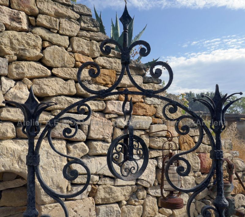 Detail of the scrap well-top on our pretty round stone and iron well | Stone well on sale at Alain BIDAL in Provence.