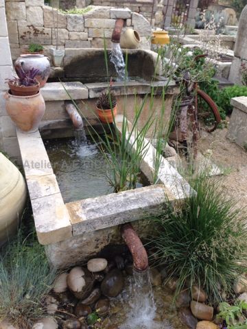 Beautiful garden fountain with craftmade dual basin - wall fountain made of stone from french quarries.