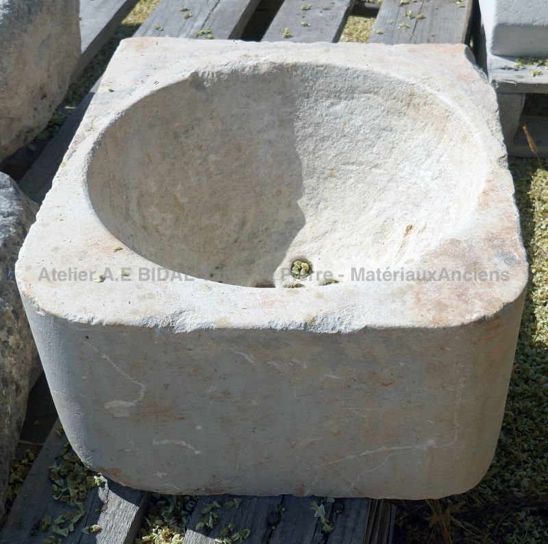 Old hard stone sink : cubic trough with round sink in stone by Alain BIDAL