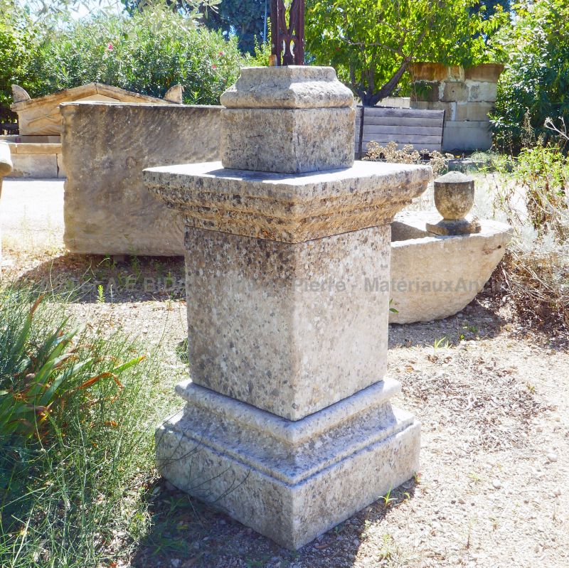 Carved limestone pedestal and reclaimed old cast iron cross : Atelier Alain BIDAL (Provence)