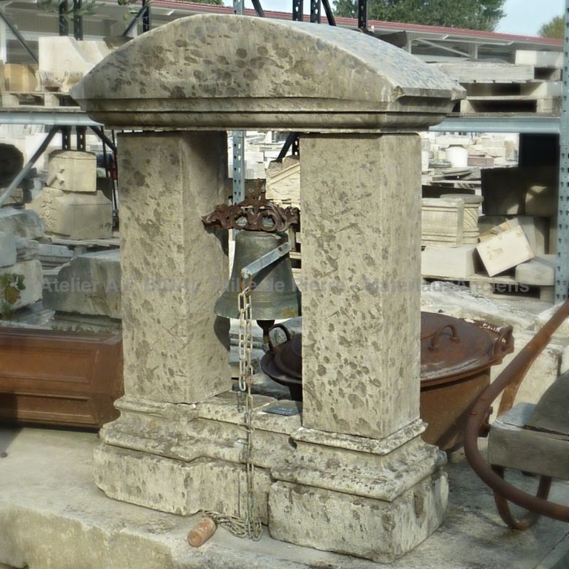 Antique bell - Old bronze bell on sale at Alain Bidal with its charming bell tower in stone.