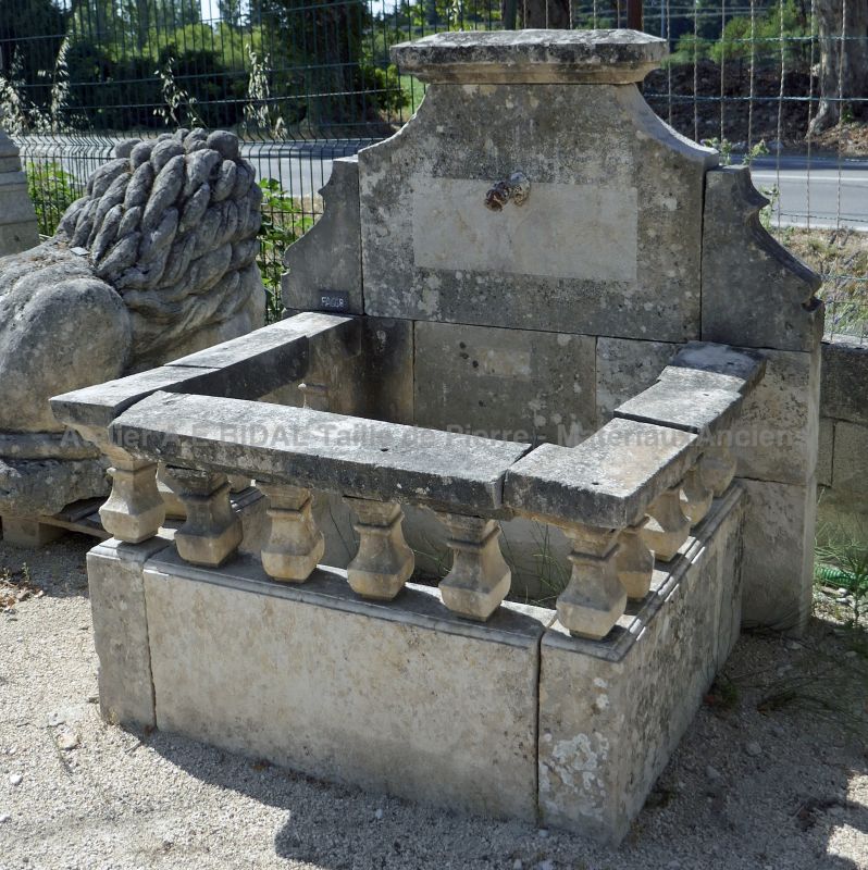 Old fountain with pediment allowing it to be made into a wall fountain in a park or garden.
