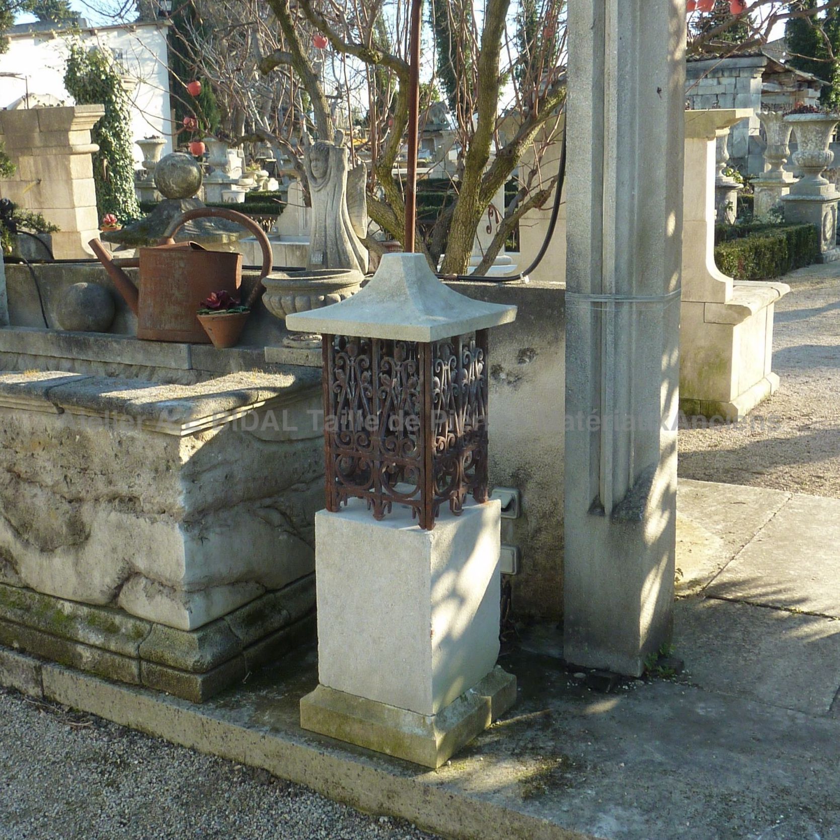 Luminaire made of stone and wrought iron with old wrought iron grids.