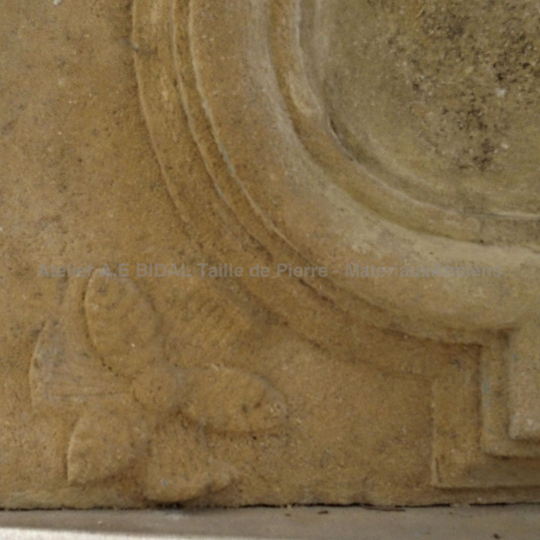 Fireplace with overmantle: stone fireplace with moldings and other decorative elements.