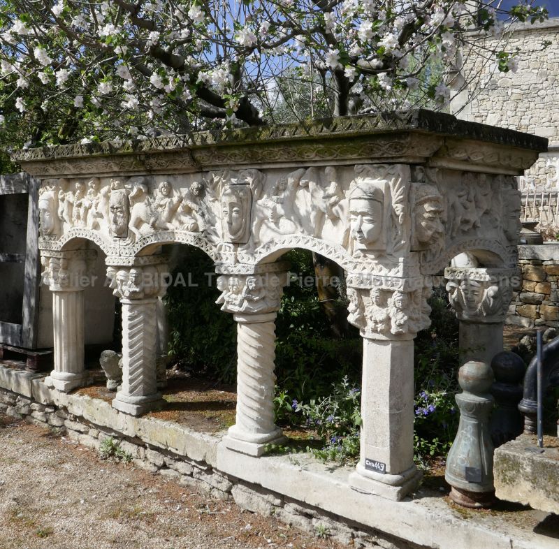 Antique stone fireplace with sculpted columns - white stone fireplace.