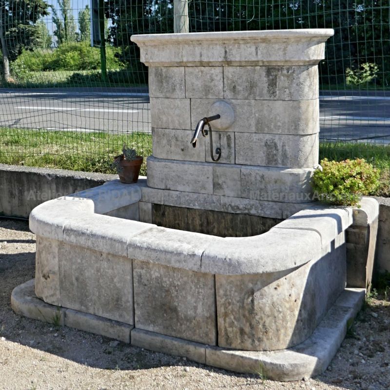 Fountain with wall and rectangular basin crafted in stone | Decorative garden fountain for sale in Provence at Alain BIDAL.