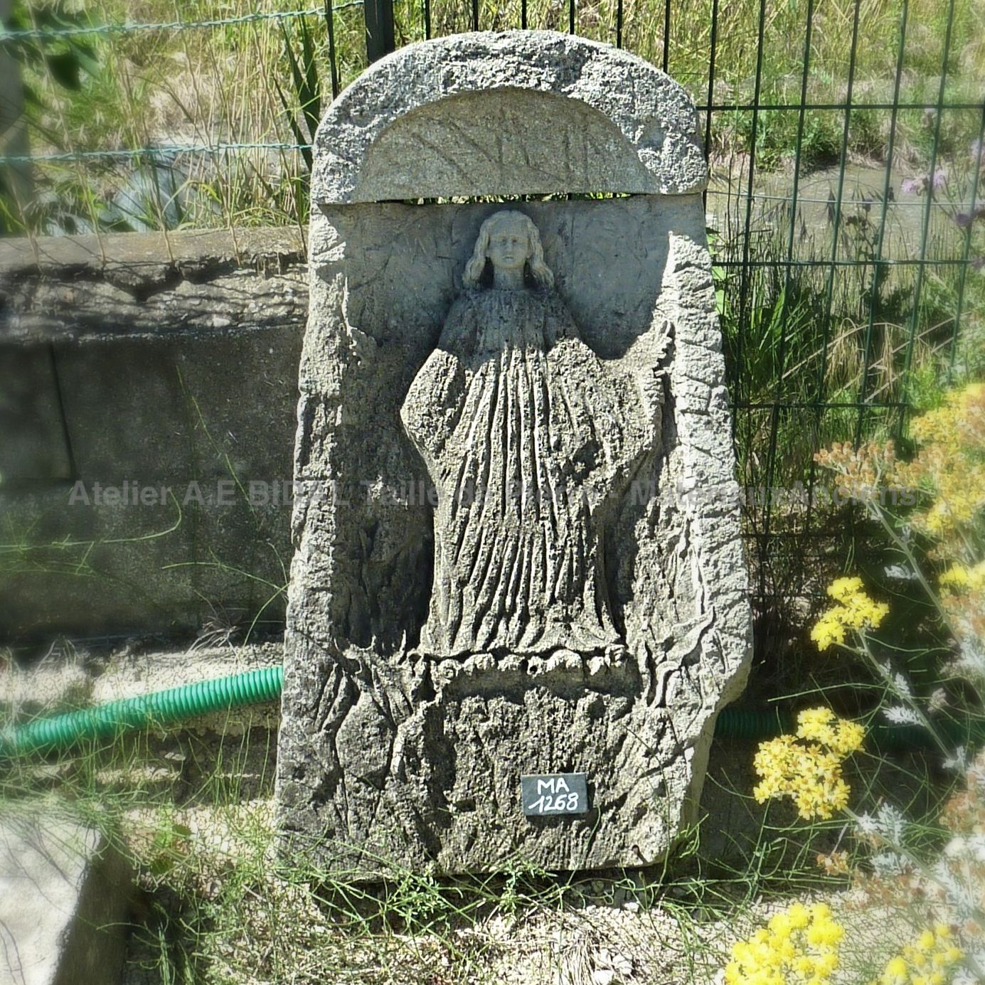 Religious elements: a magnificent stone statue representing Mary.