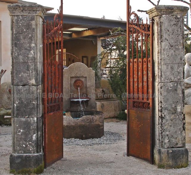 Old wrought iron gate - wrought iron oxidized by time which leaves a nice natural patina on the surface of this old gate.