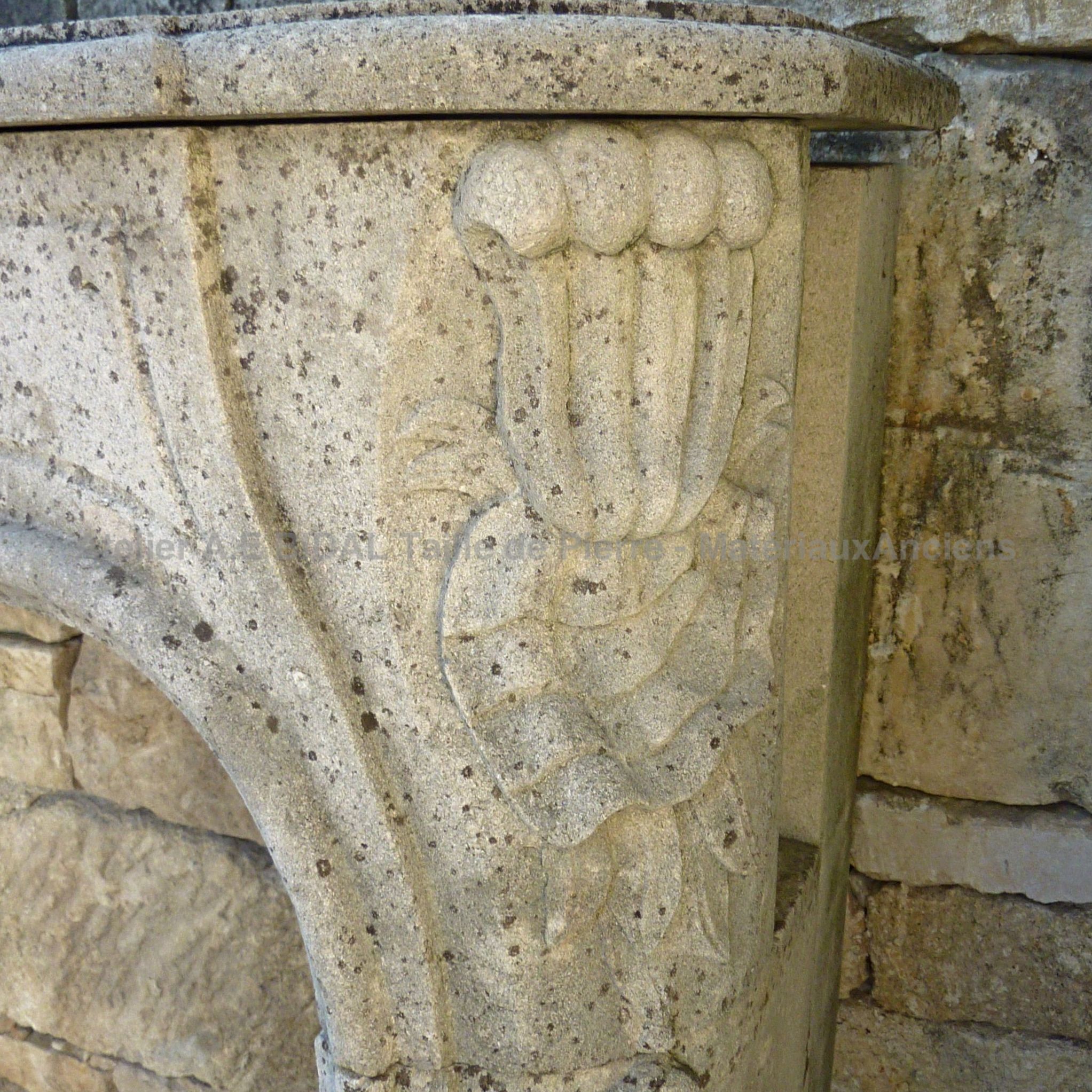 Old fireplace made of natural stone extracted in Lorraine.