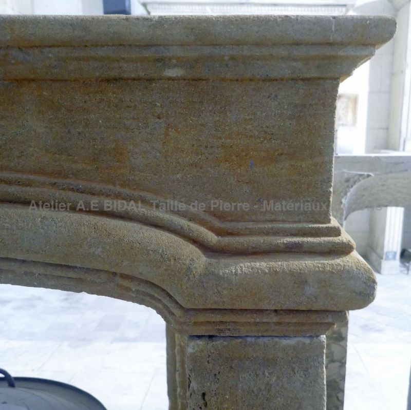 Antique 19th-century golden stone fireplace : Atelier Alain Bidal, Provence
