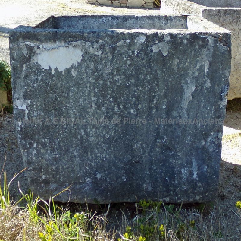 Antique rectangular trough with a rustic appearance