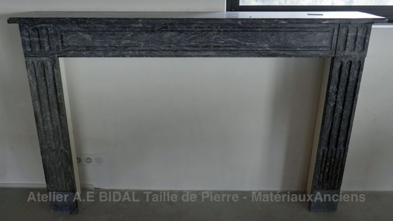Authentic antique black marble mantle for sale at Atelier Alain Bidal Antique Materials in Provence.