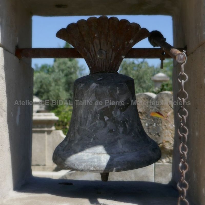 Detail of the antique bell on our stone pillar for house portal.