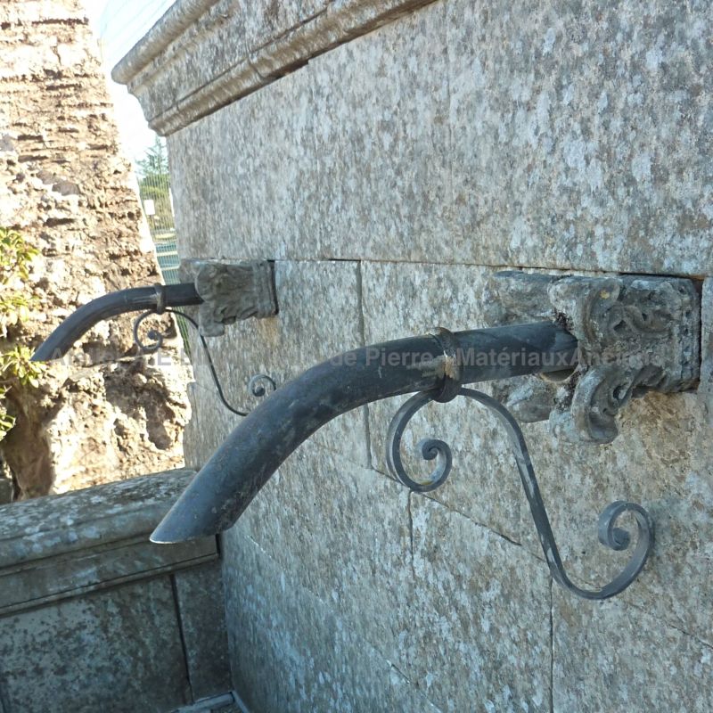 Detail of the old water outlets in metal from our large wall-fountain in stone ǀ Alain Bidal in Provence