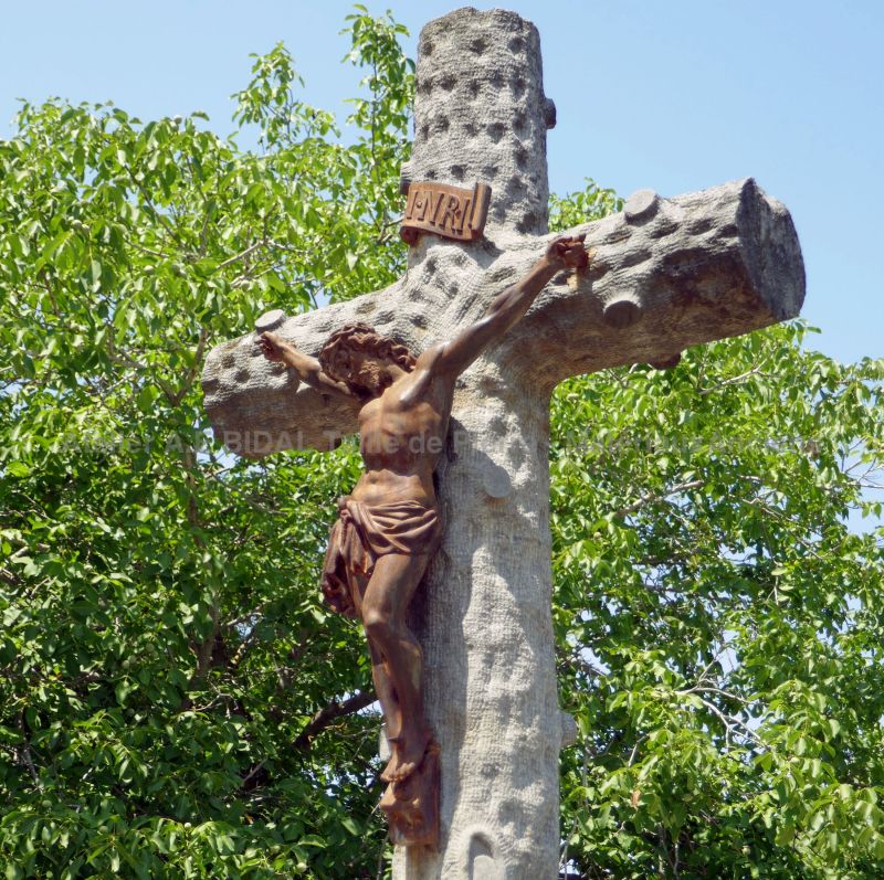 Large stone cross with Christ attached to this Catholic cross.