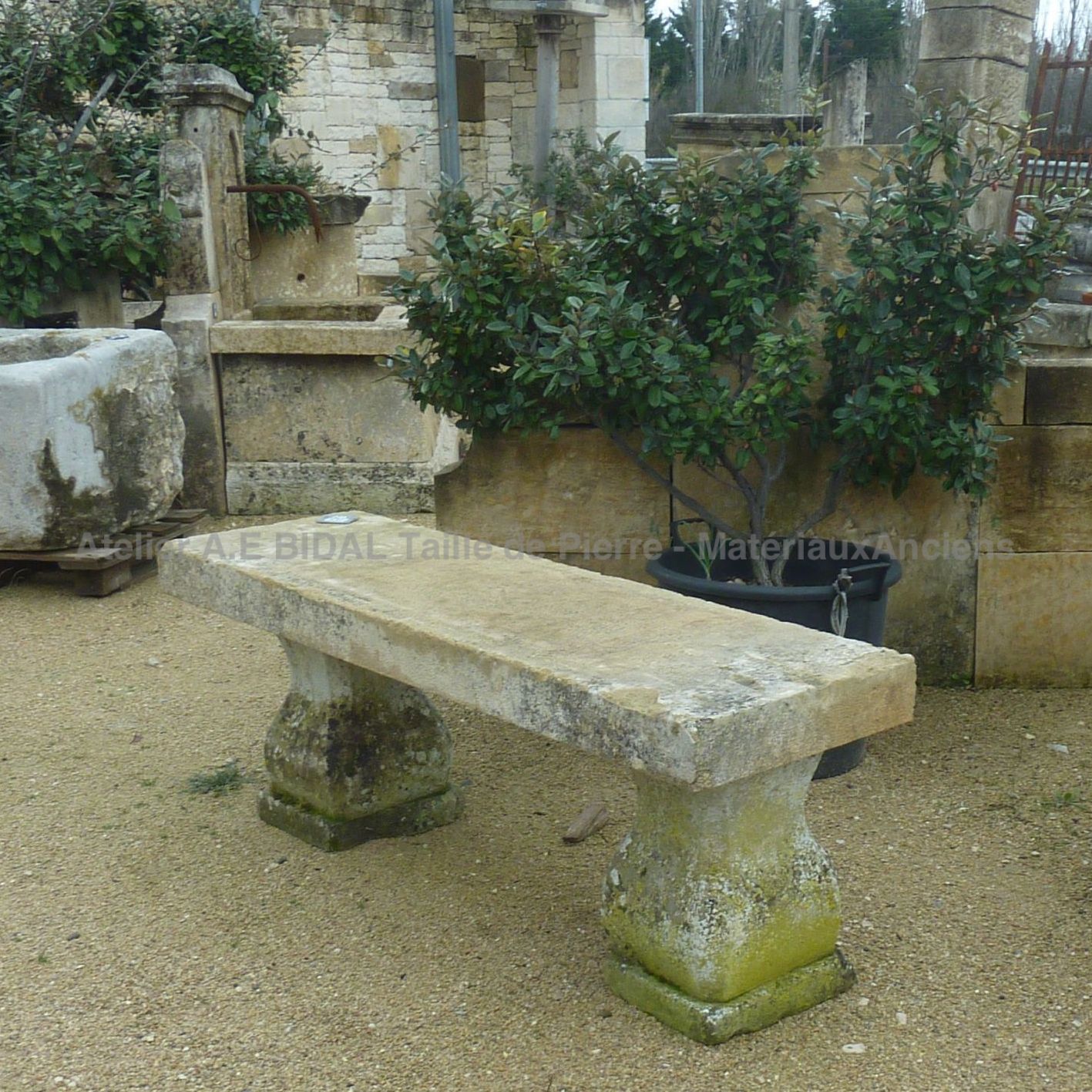 Antique rectangular stone bench with molded feet