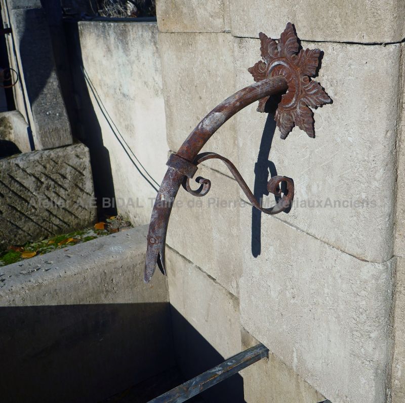 Wrought iron water spout and old cast iron rosette on our garden wall fountain in stone - Atelier Alain BIDAL, Provence