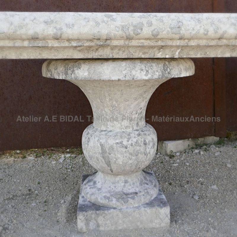 Detail of one of two limestone vases used as jambs on our garden bench in stone.