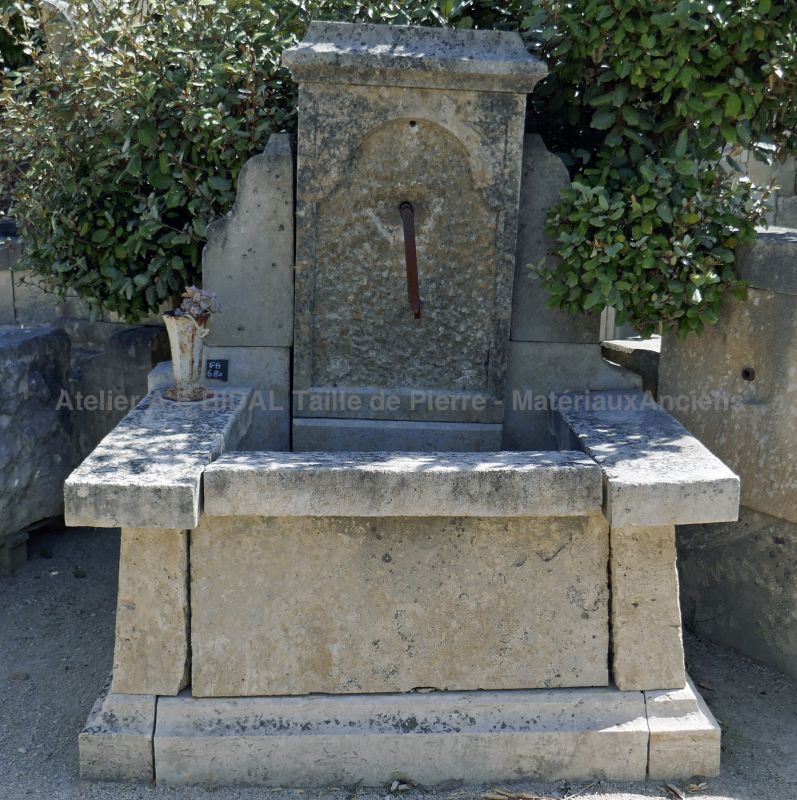 Small fountain - a petite garden fountain in aged and patinated stone