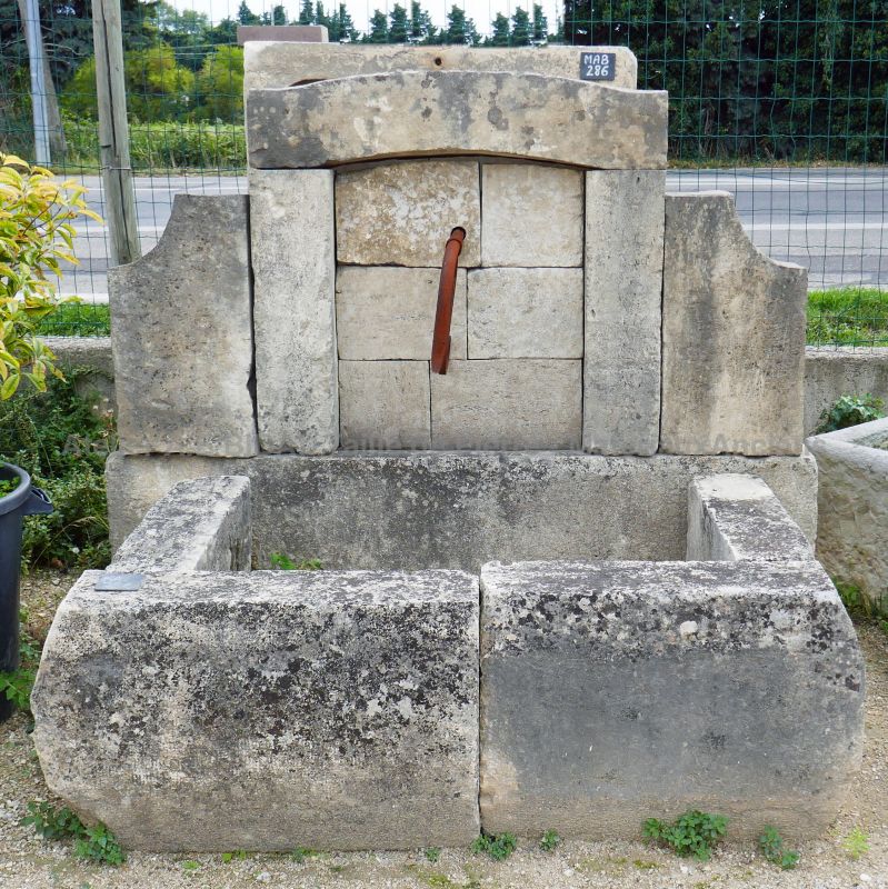 Outdoor fountain with rectangular basin - a nice garden fountain in stone.
