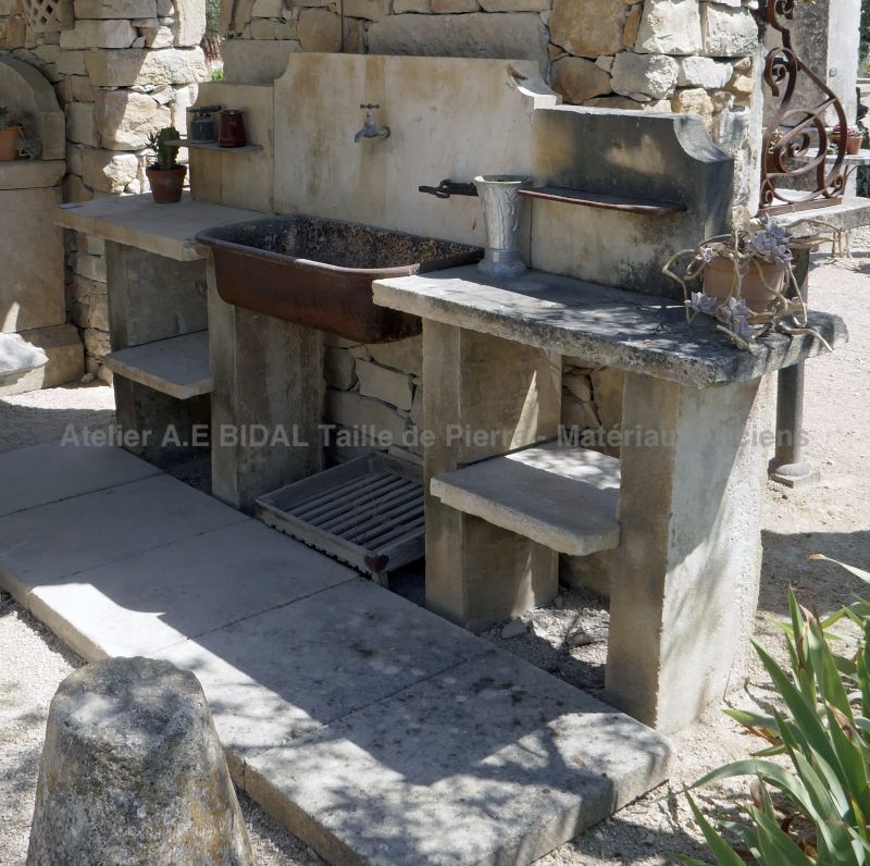 Summer kitchen with sink on jambs and pediment in stone | Antique garden furniture on sale at Alain Bidal in Provence.