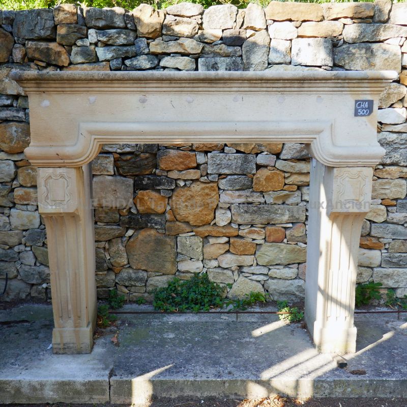 Louis 14 fireplace carved in limestone - light colored decorative mantle.
