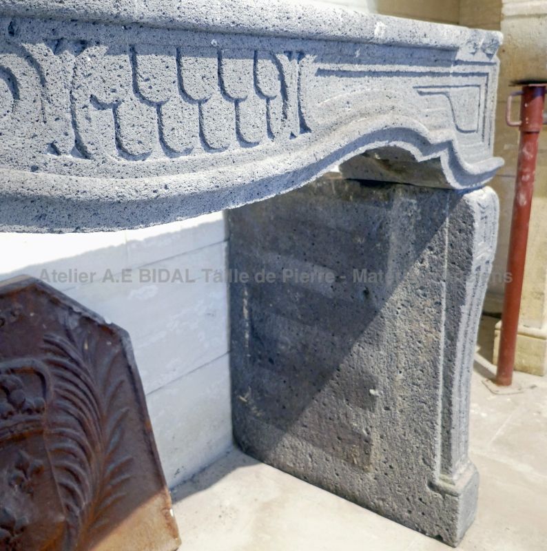 Large volcanic stone fireplace, a 19th century mantel for sale at Atelier Alain BIDAL, Provence