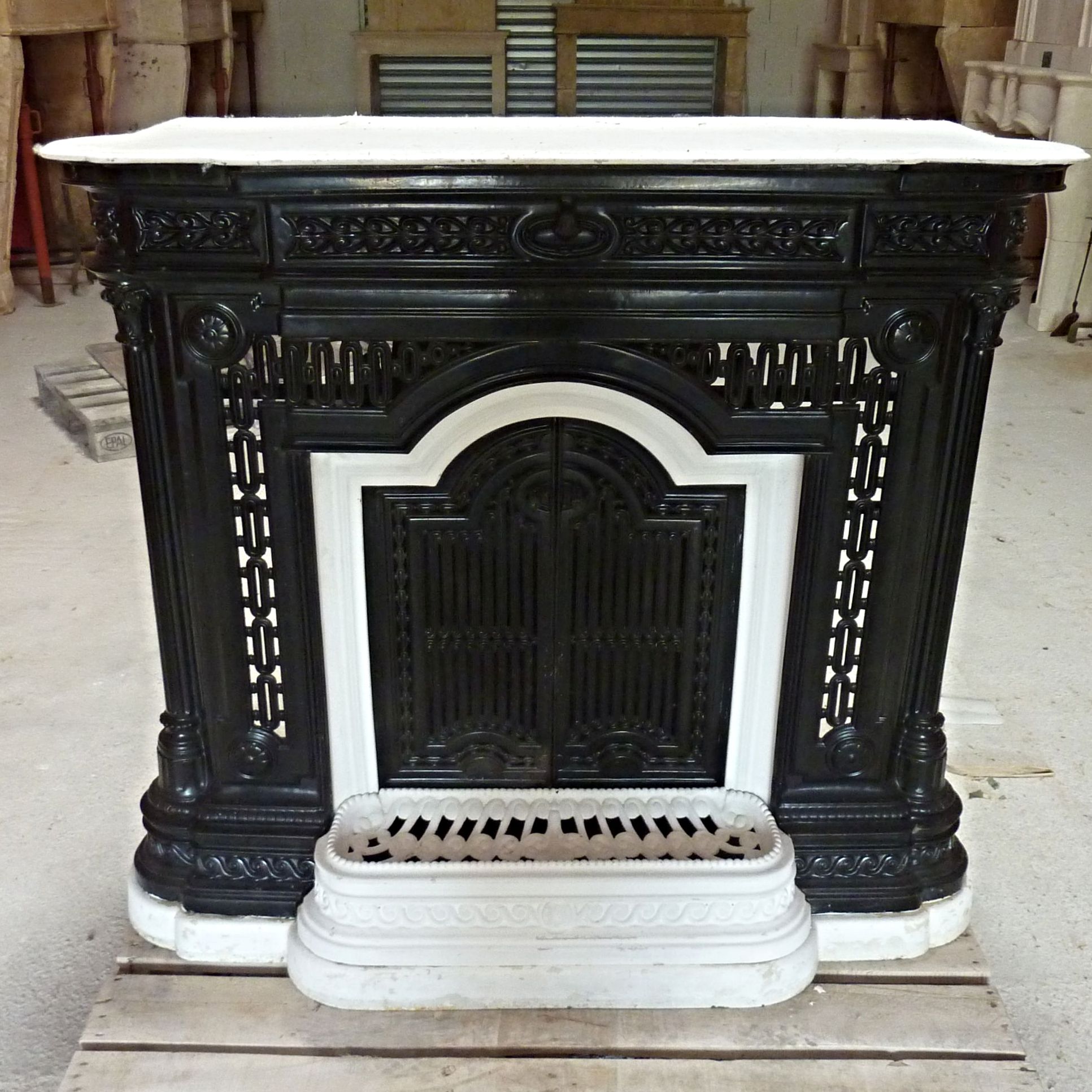Antique fireplace made of black cast iron: fireplace 19 th century