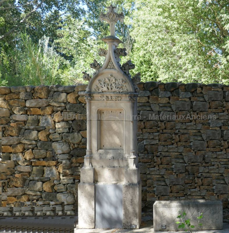 Beautiful Gothic stele with stone cross at the top.