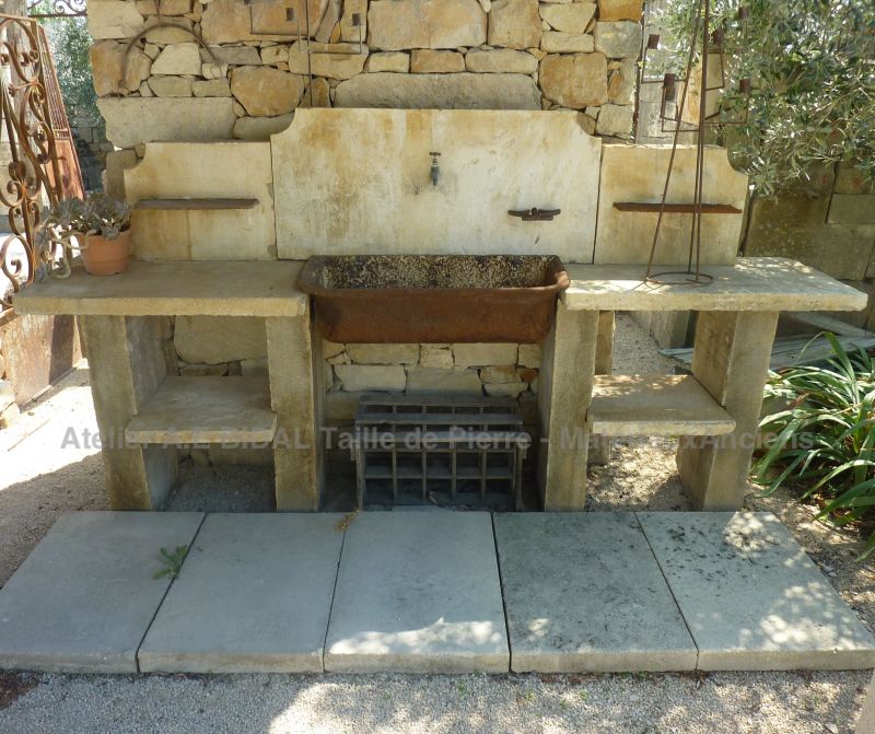 Beautiful summer kitchen with stone pediment and elements in old materials | Antique garden furniture.