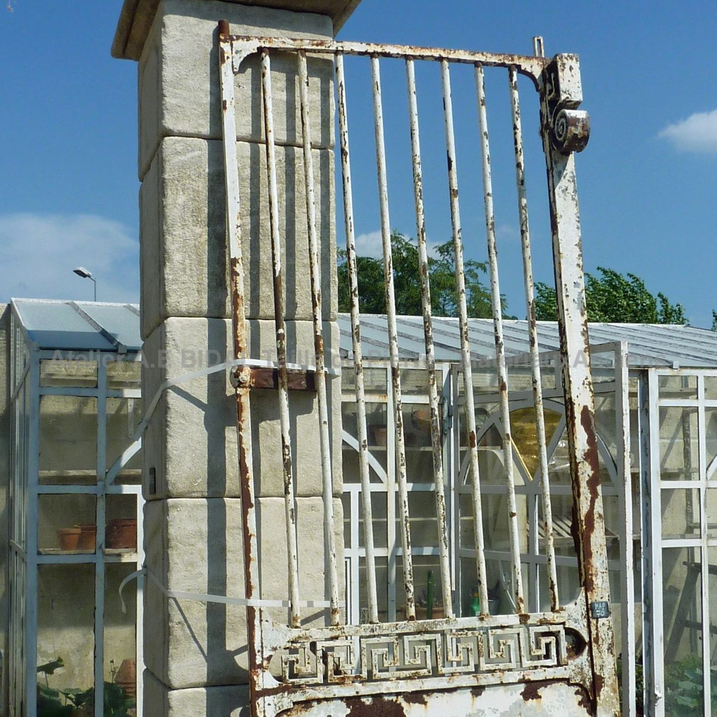 Old wrought iron gate craftmade with beautiful hadnmade decorations.