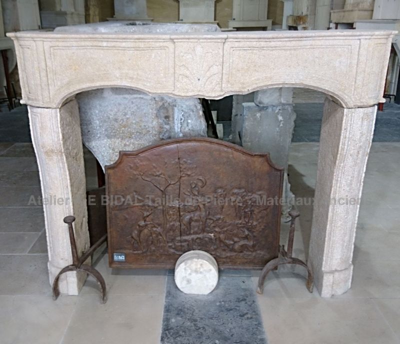 Louis 15 stone fireplace with a very neat look - an antique weathered stone fireplace.