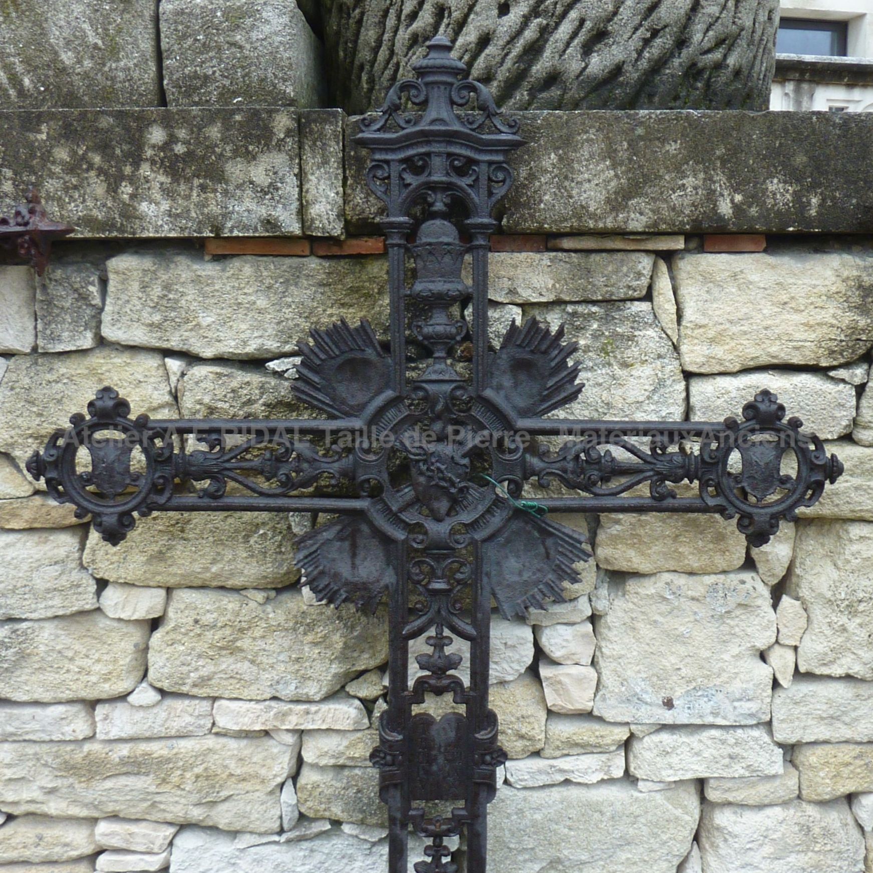 Beautiful old cross - a Christian cross decorated with many religious elements.