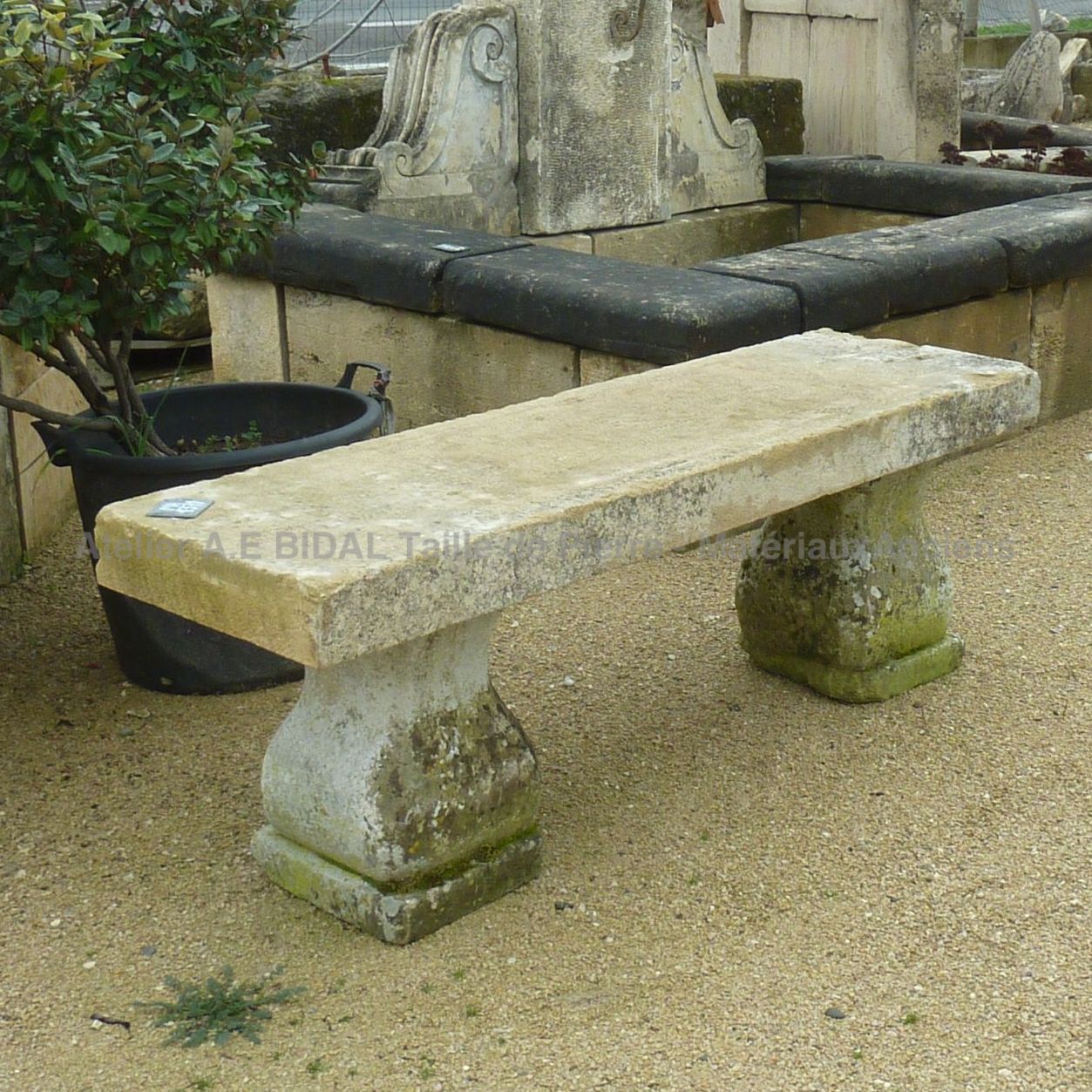 Antique rectangular stone bench with molded feet