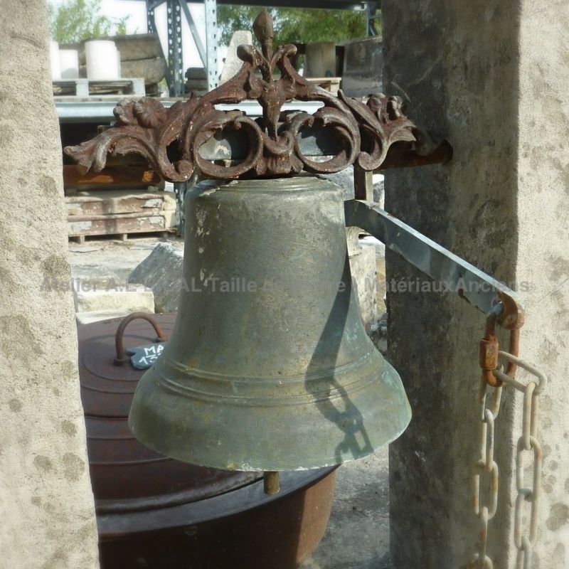 Antique door bell - A bronze bell and its stone bell tower from Atelier Bidal.