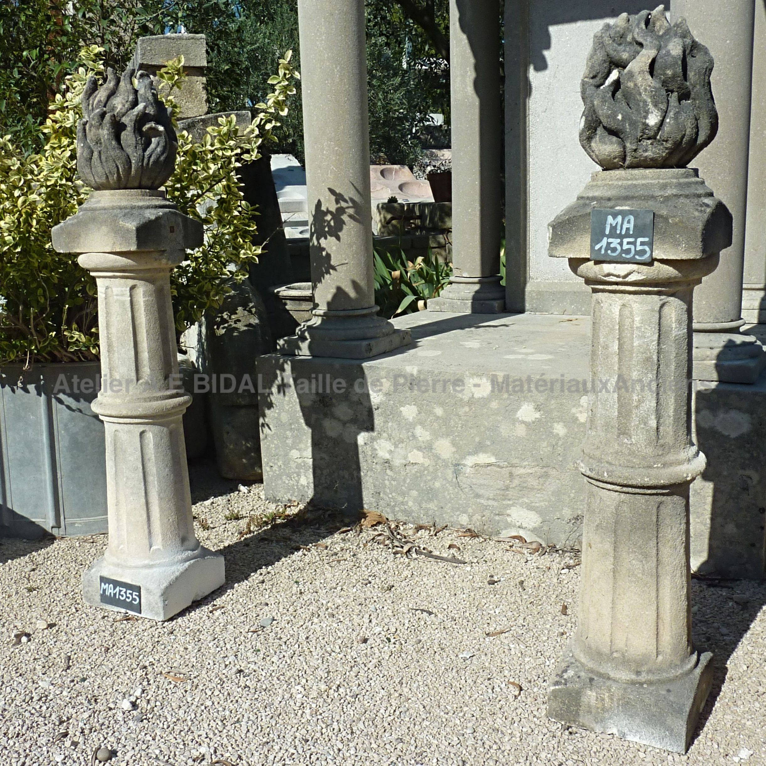 Pair of stone pilasters with flame ornements ** SOLD