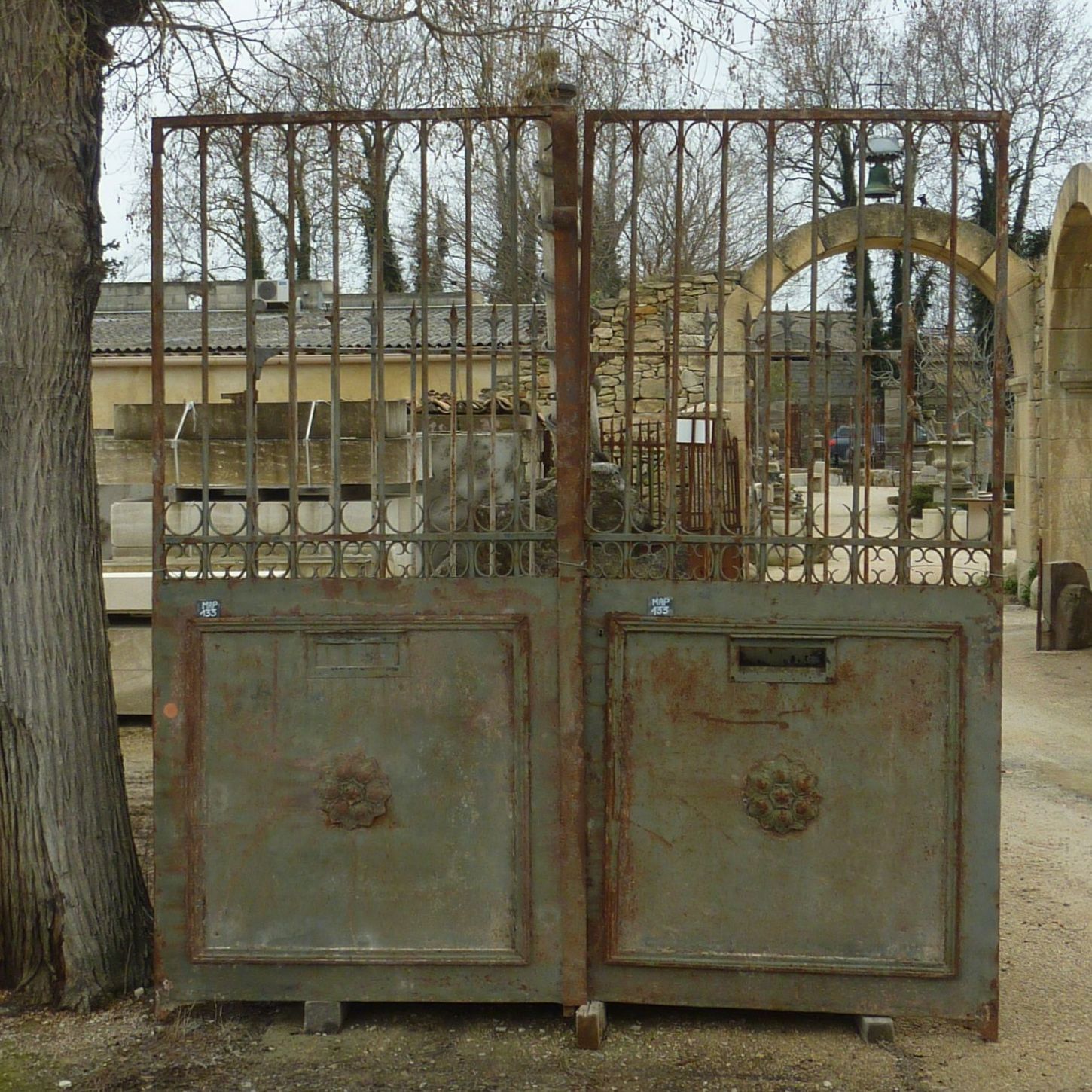 Small old gate - wrought iron gate in an old double gate style.