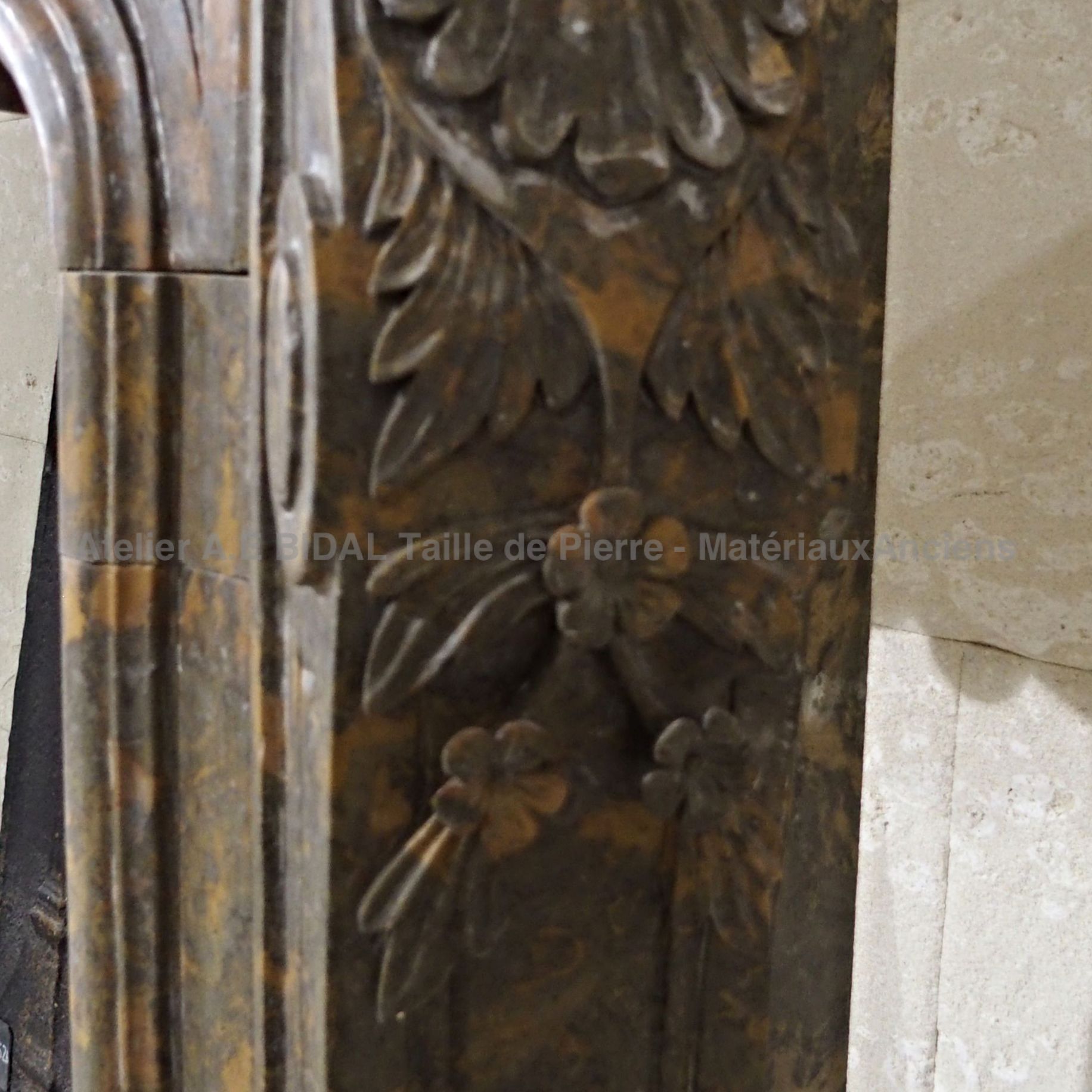 Fireplace made of brown marble decorated with floral and vegetable motifs - a sumptuous old marble fireplace.